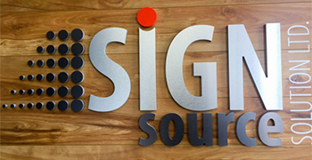 sign source solution logo on wooden board