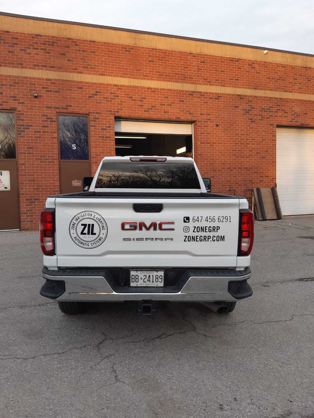 pick-up truck vinyl lettering on the back side