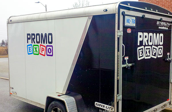 cargo trailer with vinyl advertisement and logo